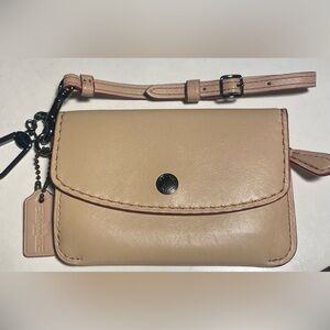 COACH rare wristlet in tan with red contrast.